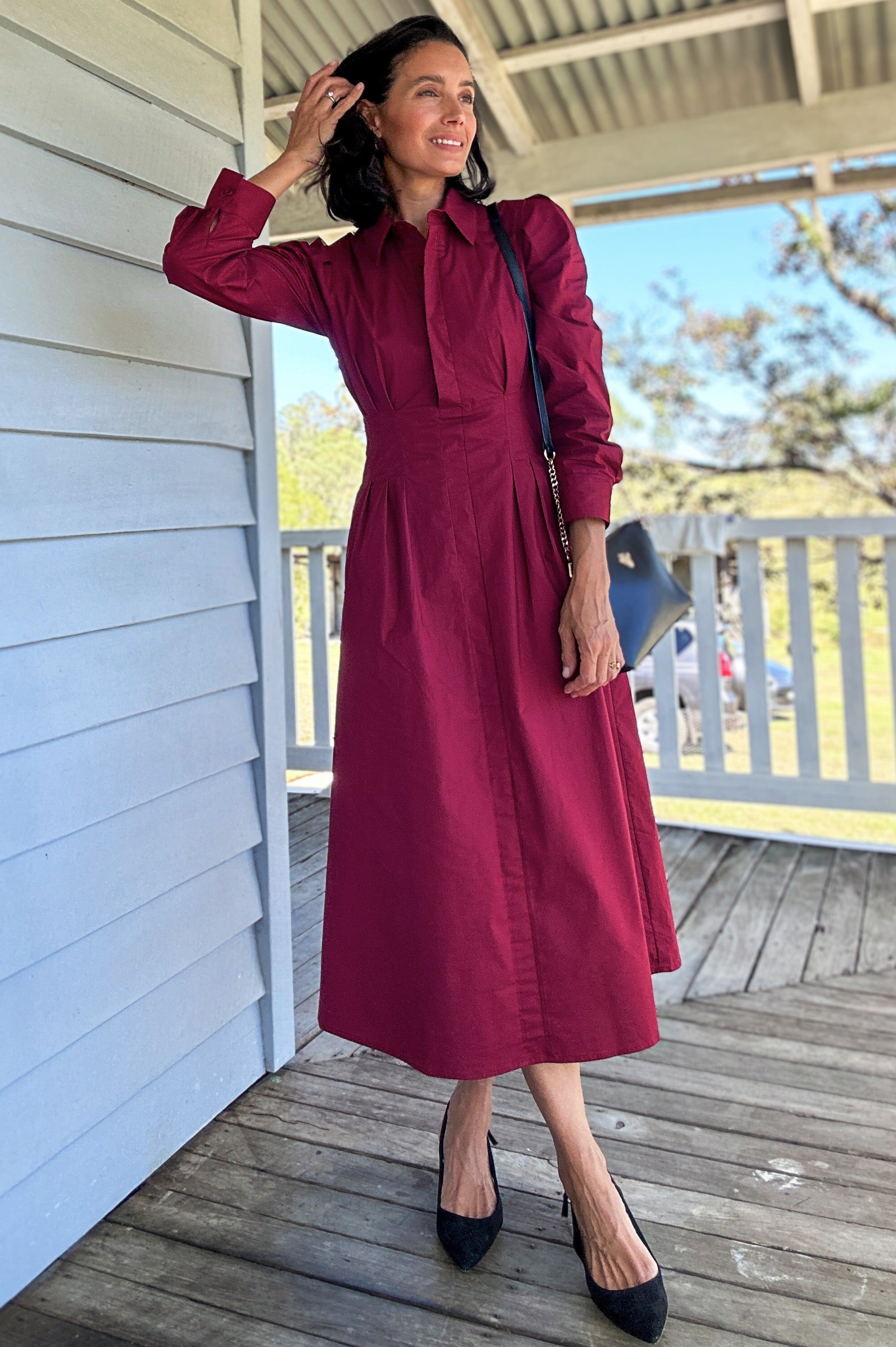 merlot long sleeve dress ARRANGE long sleeve draped satin maxi dress with gold hardware in merlot